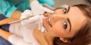 woman having braces removed